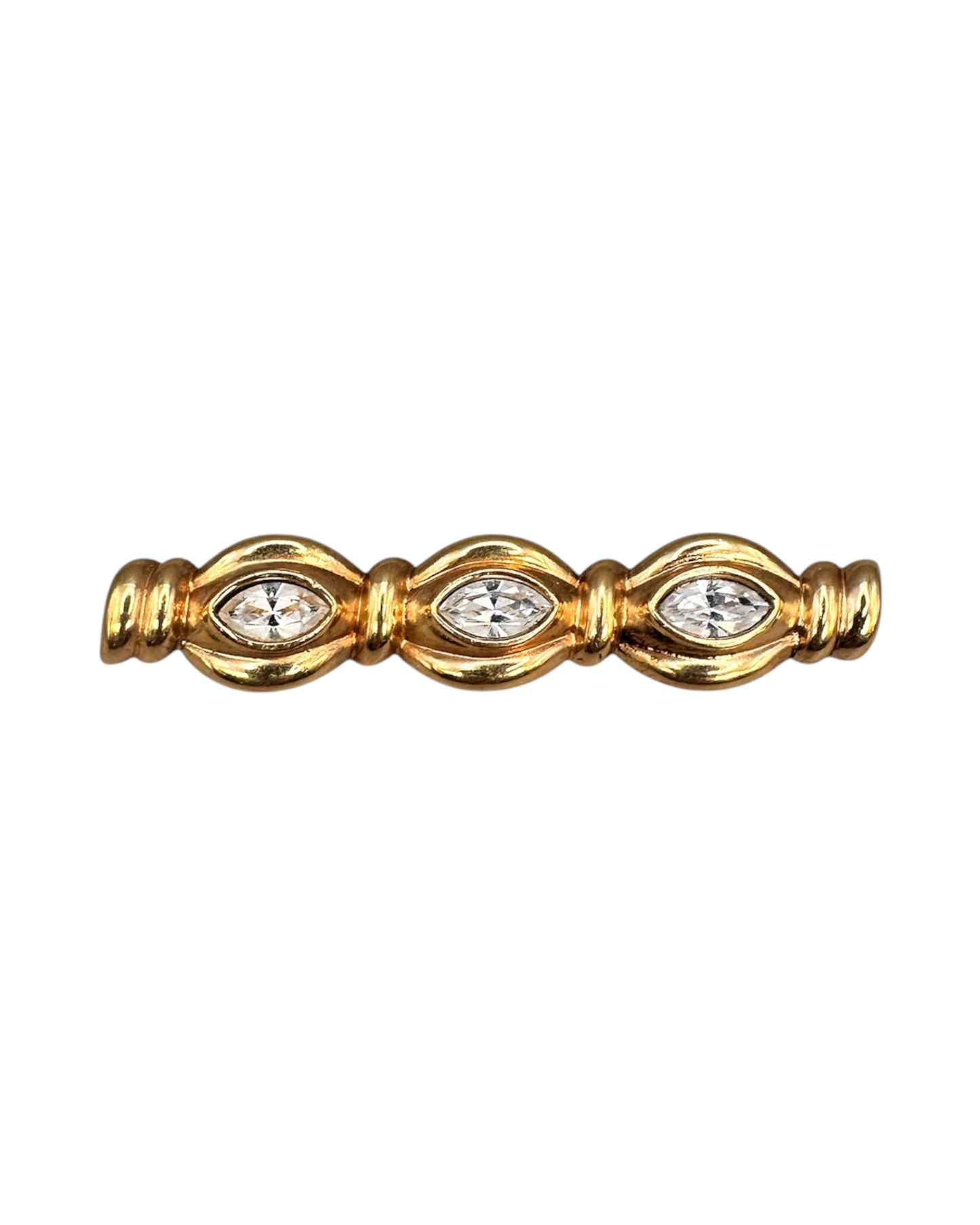Front three-quarter view of gold-tone crystal bar pin showing bezel-set marquise stones