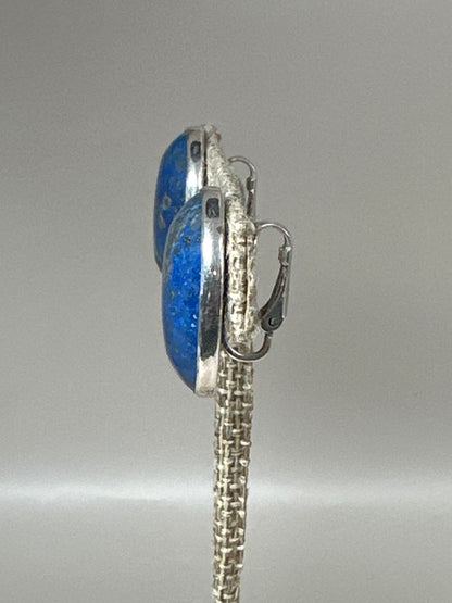 Side profile view showing bezel setting depth and hinged clip mechanism with comfort pad