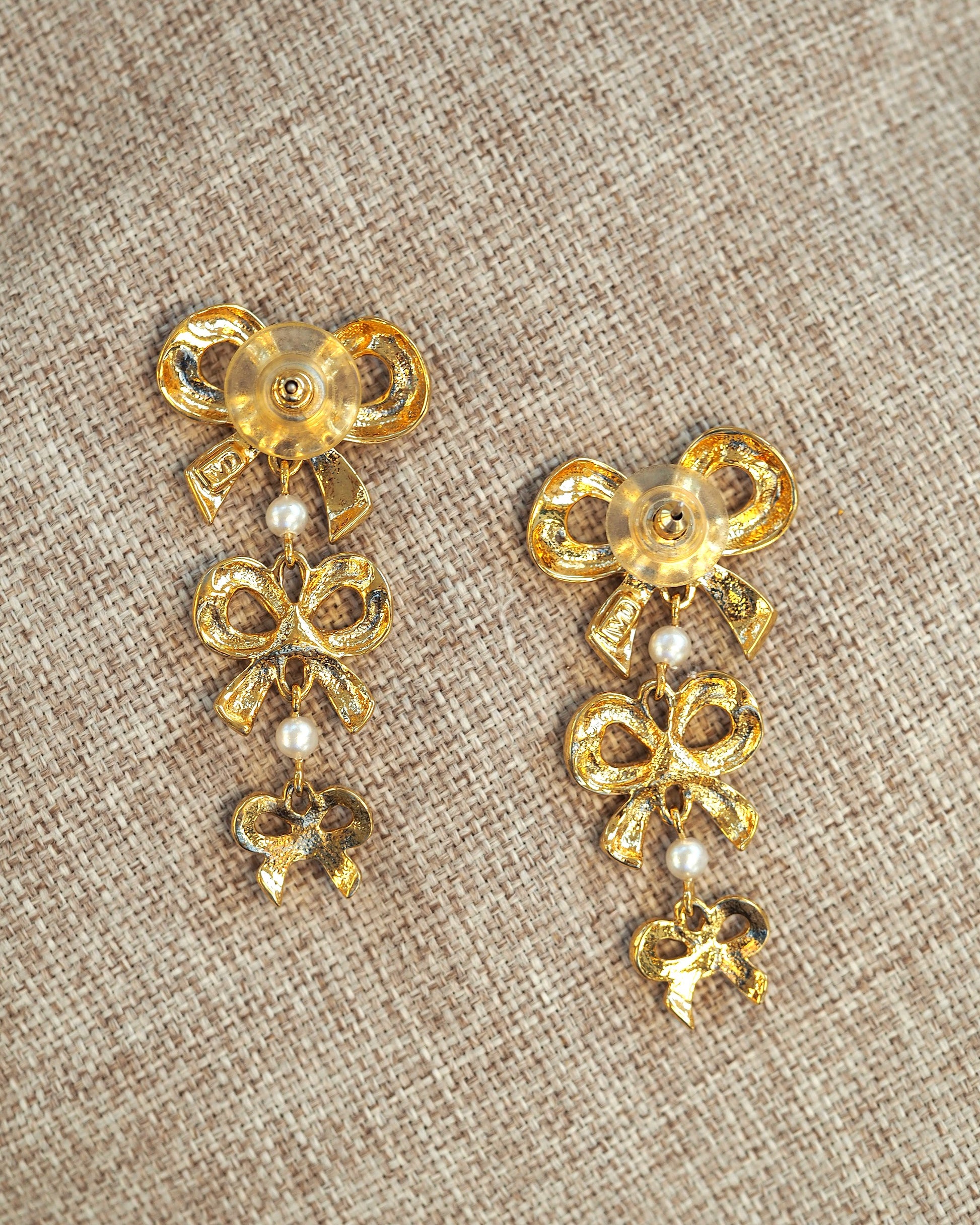 Earrings held in palm for scale, showing full 2.25-inch drop length