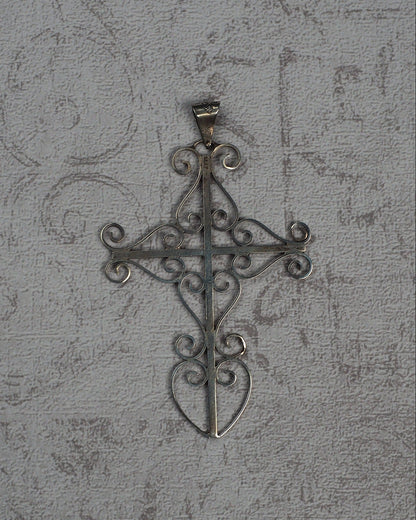 Vintage Taxco sterling silver openwork cross pendant with scrollwork, front view