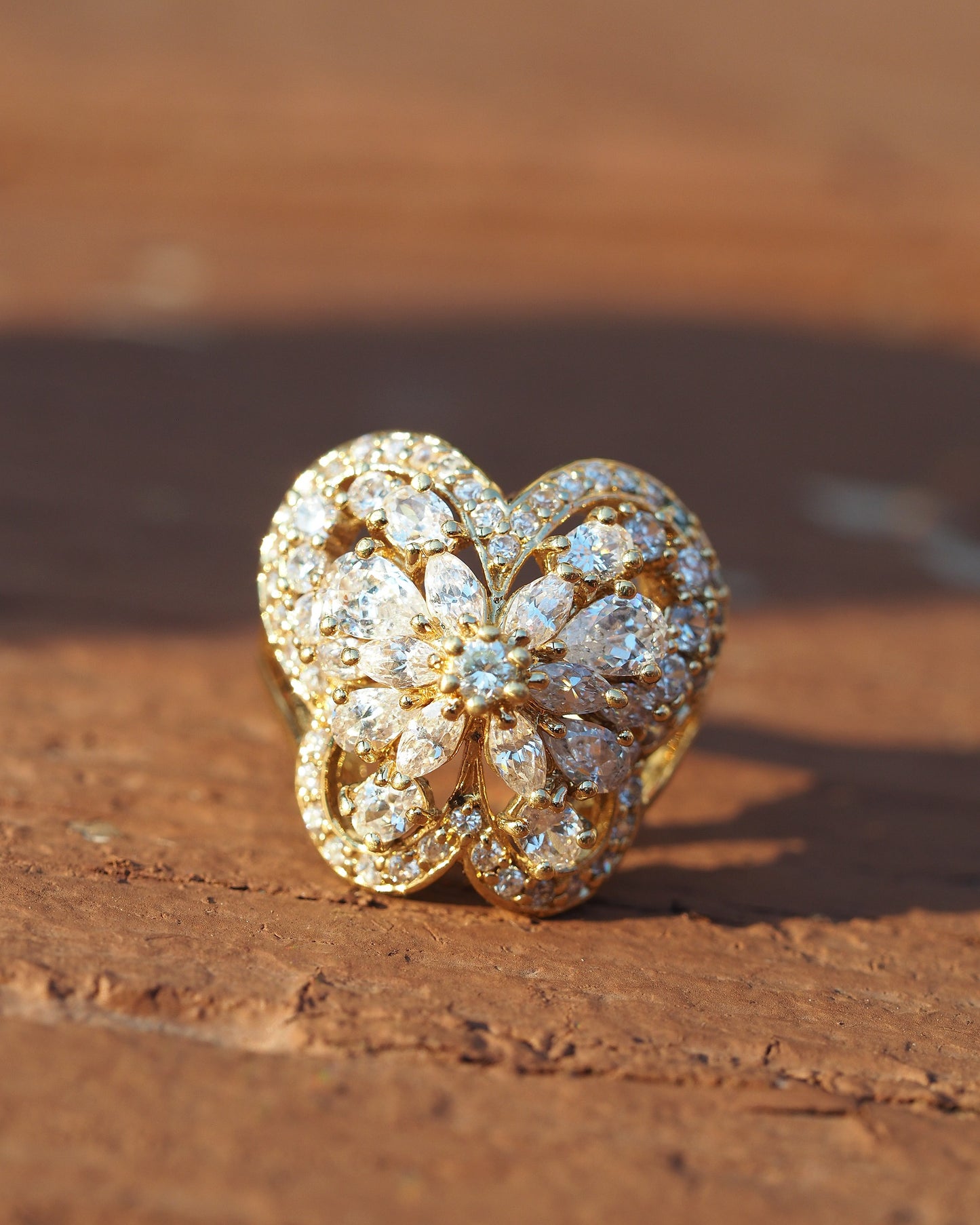 Close-up front view of butterfly motif with marquise and round rhinestones forming four-lobed wing pattern