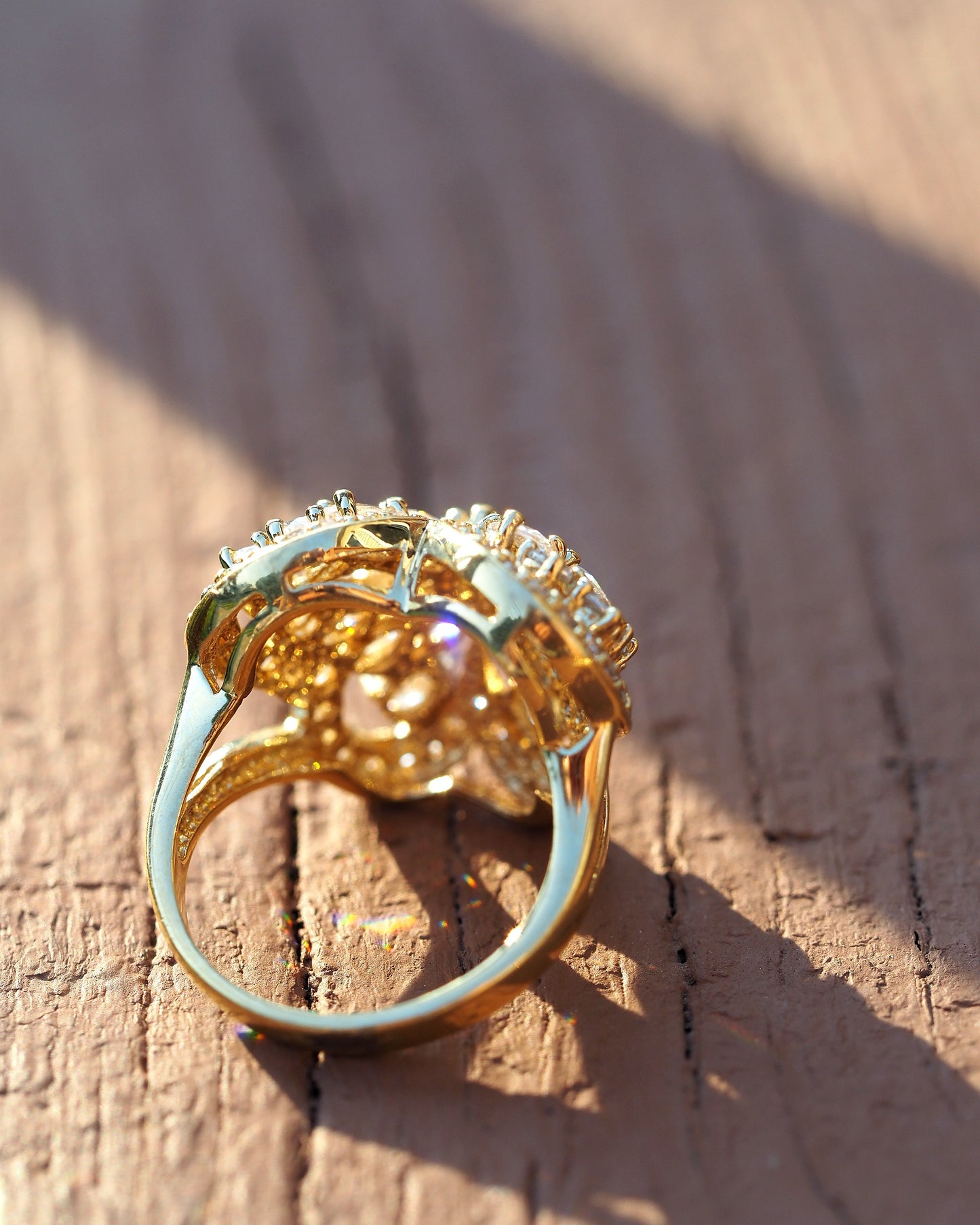 Back view of gold vermeil ring showing openwork underside and smooth band