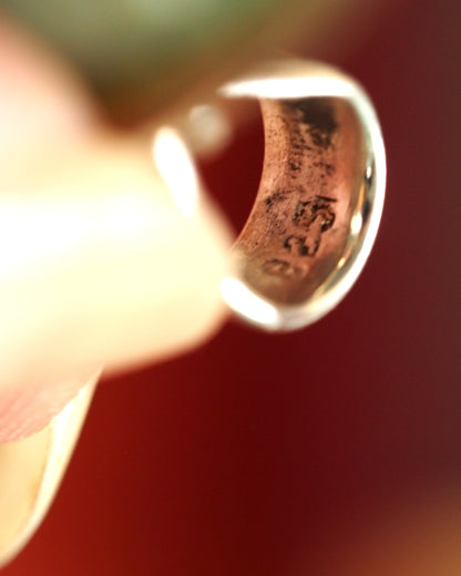Close-up of the sterling silver slide bail stamped 925 on the aventurine elephant pendant