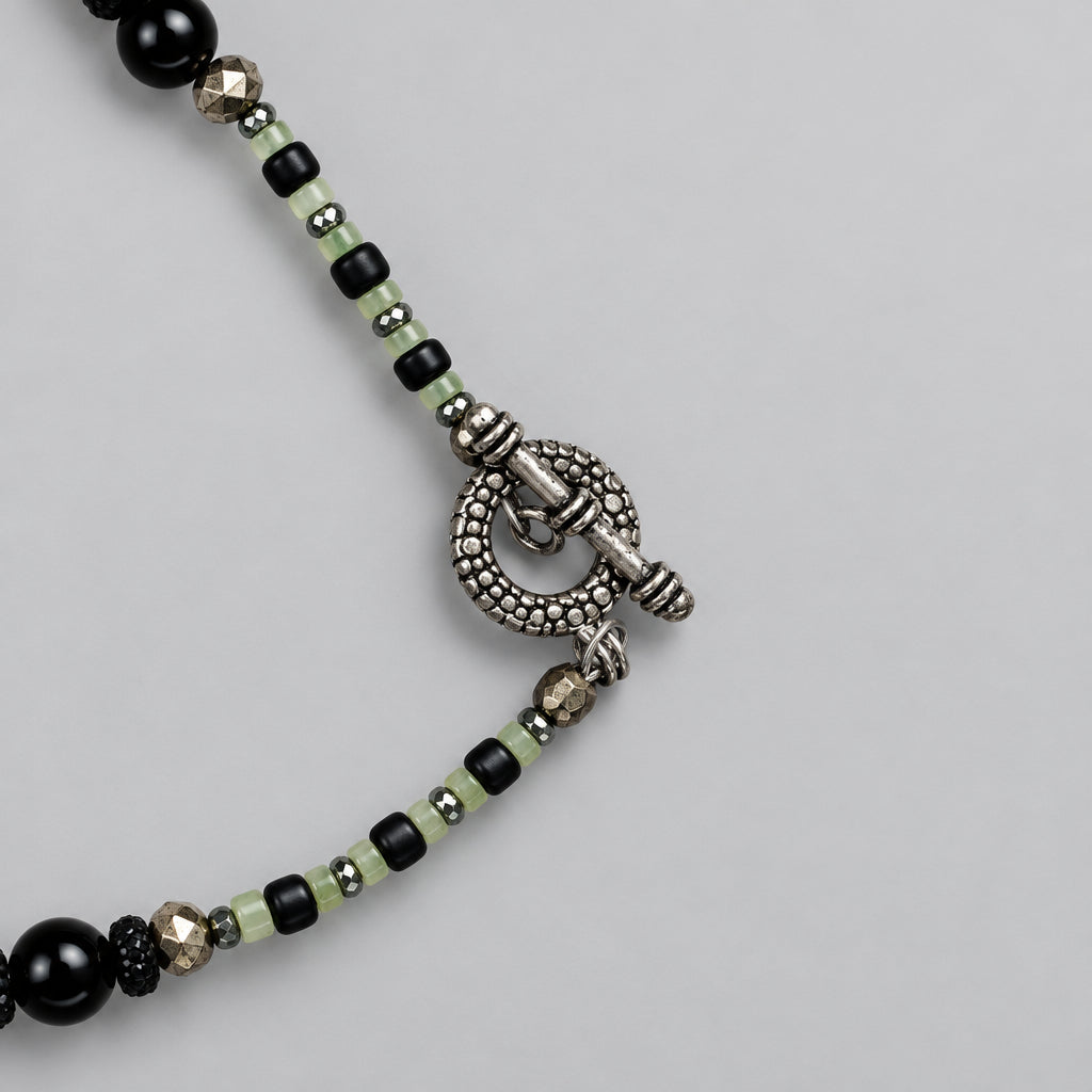 Silver-tone toggle clasp with green and black seed beads on handmade Halloween necklace