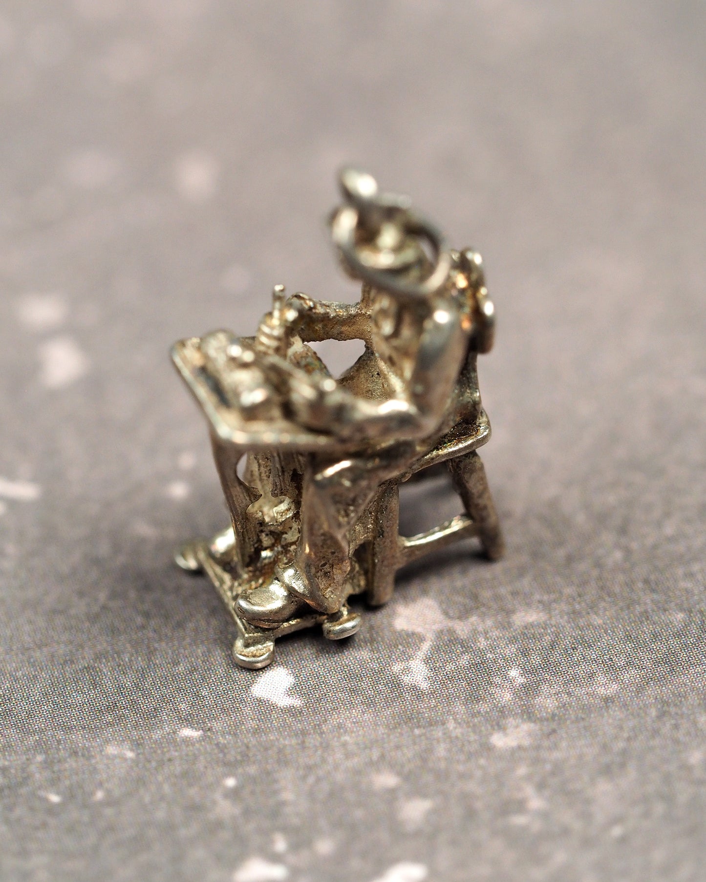 back view of 800 silver lacemaker charm showing openwork chair and A800 stamp