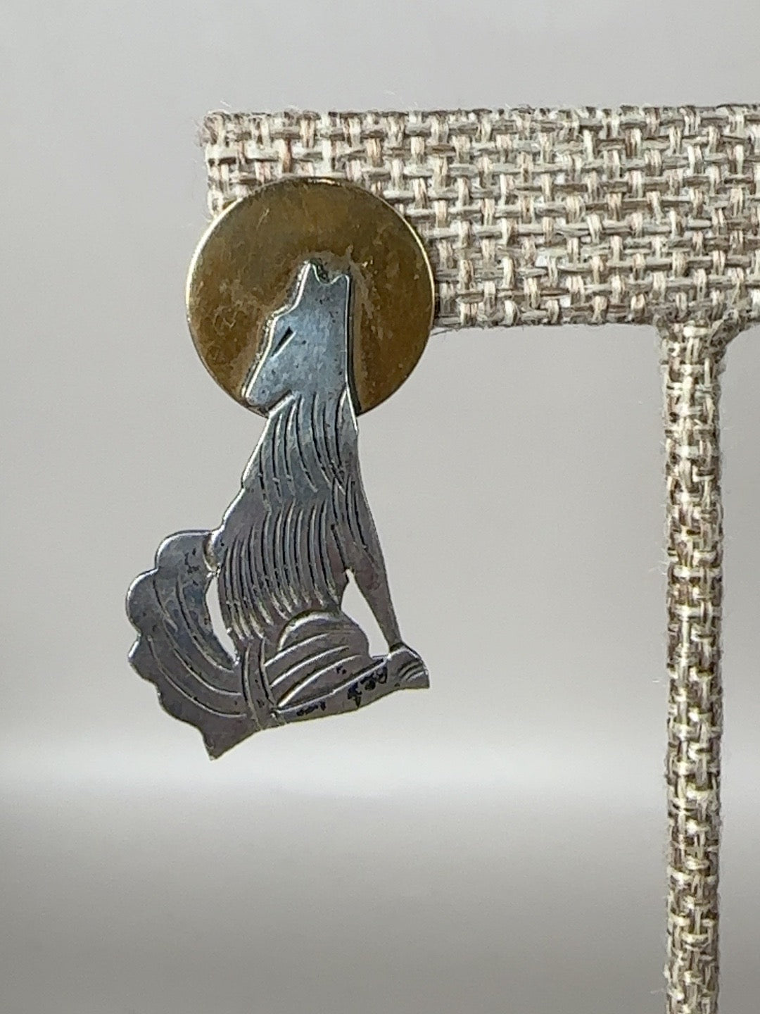 Vintage sterling silver and brass howling coyote moon earring detail