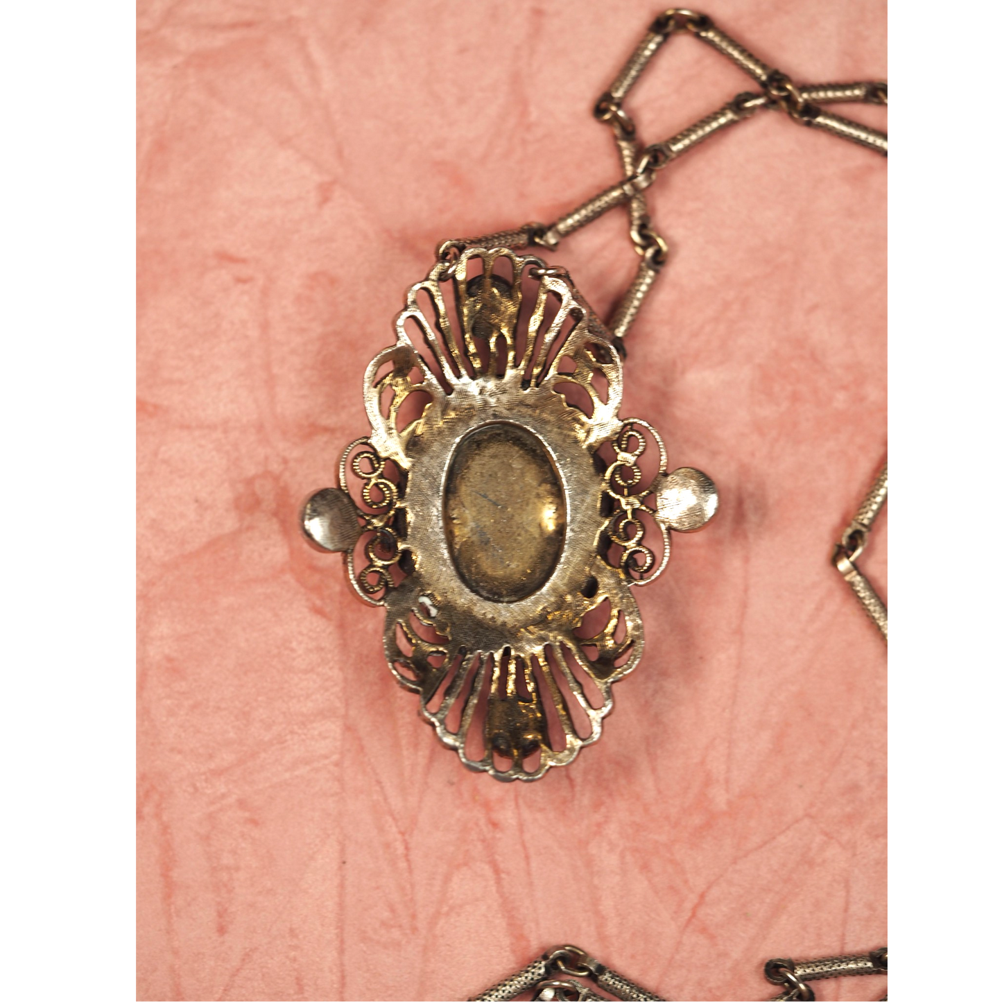 Domed blue and green floral cabochon in openwork filigree pendant