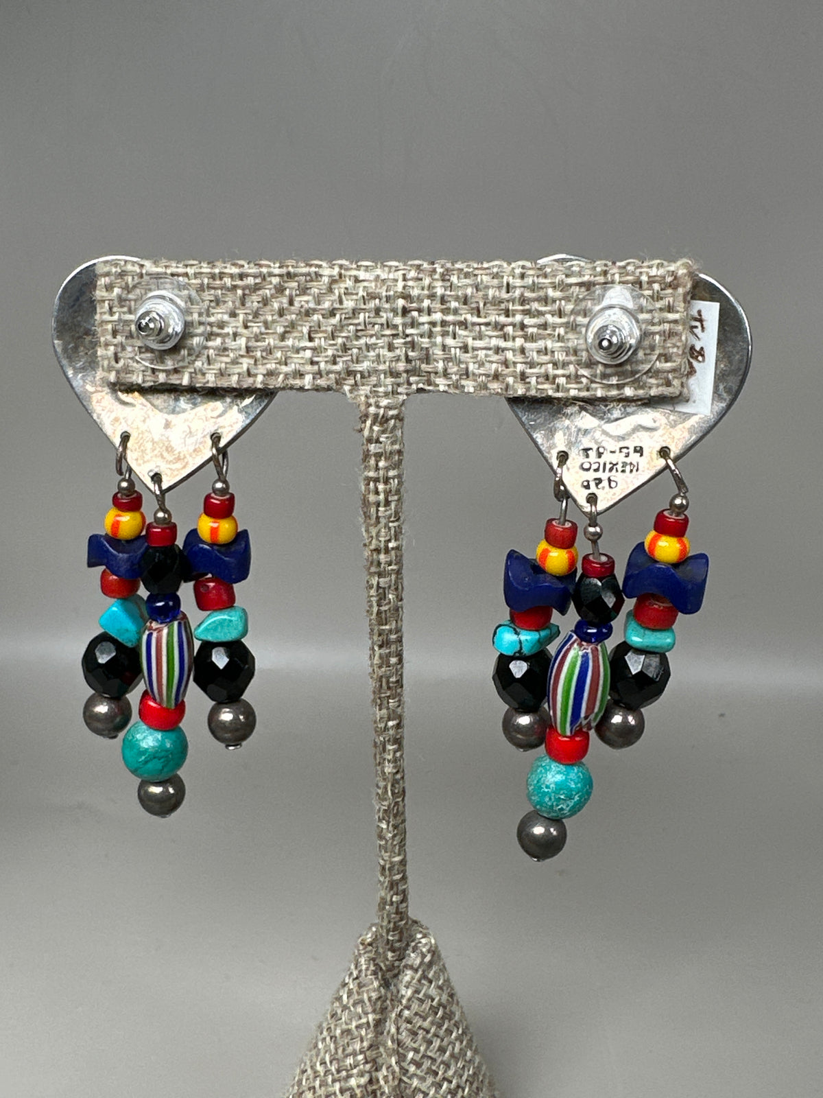 Back view of sterling silver Taxco heart pierced earrings showing TS-59 MEXICO 925 hallmarks