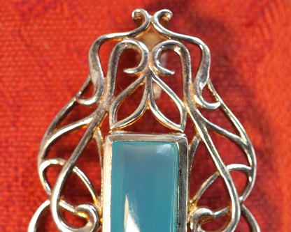 Top detail of Derewala pendant showing slide bail and upper scrollwork