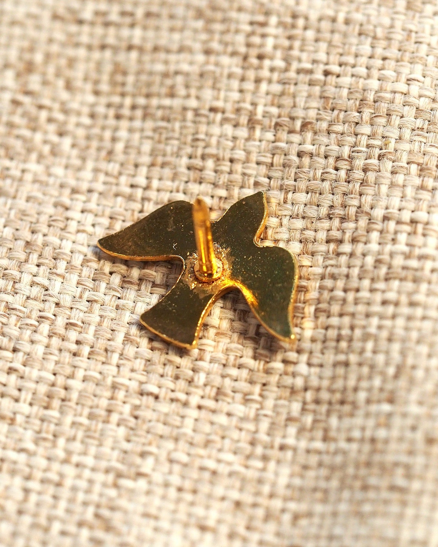Back view of the gold-tone dove brooch showing the squeeze-back tac pin mechanism