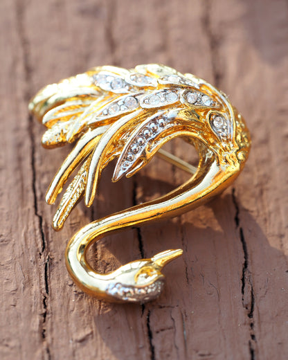 Three-quarter angle view of Marvella swan brooch showing arched neck and raised wings