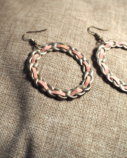 Reverse view of 1970s pink enamel chainlink hoop earrings showing wire hook closures and aged silver-tone finish