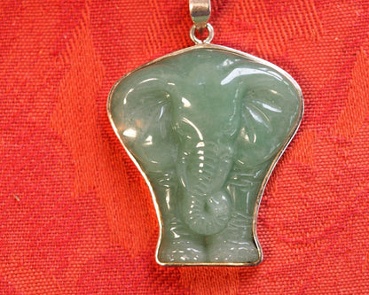Sterling silver aventurine elephant pendant in pale sage-green, carved silhouette with raised trunk and fanned ears, front view