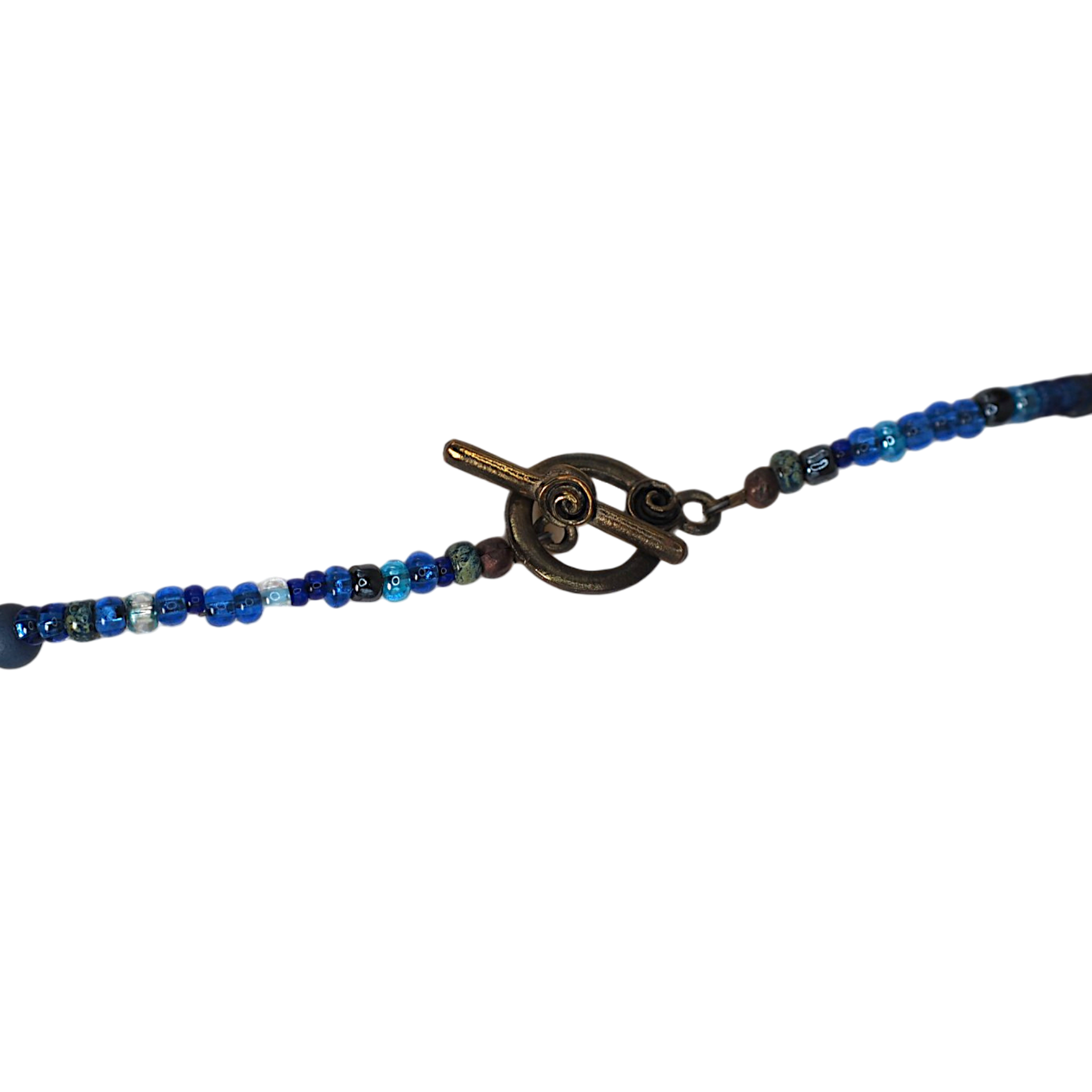 Blue owl handbeaded necklace styled flat lay, one of a kind