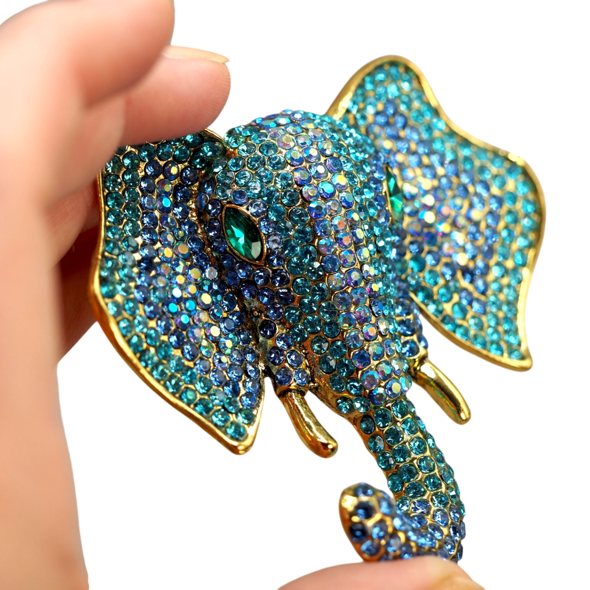 Oversized elephant brooch with green marquise eyes and gold tone detailing