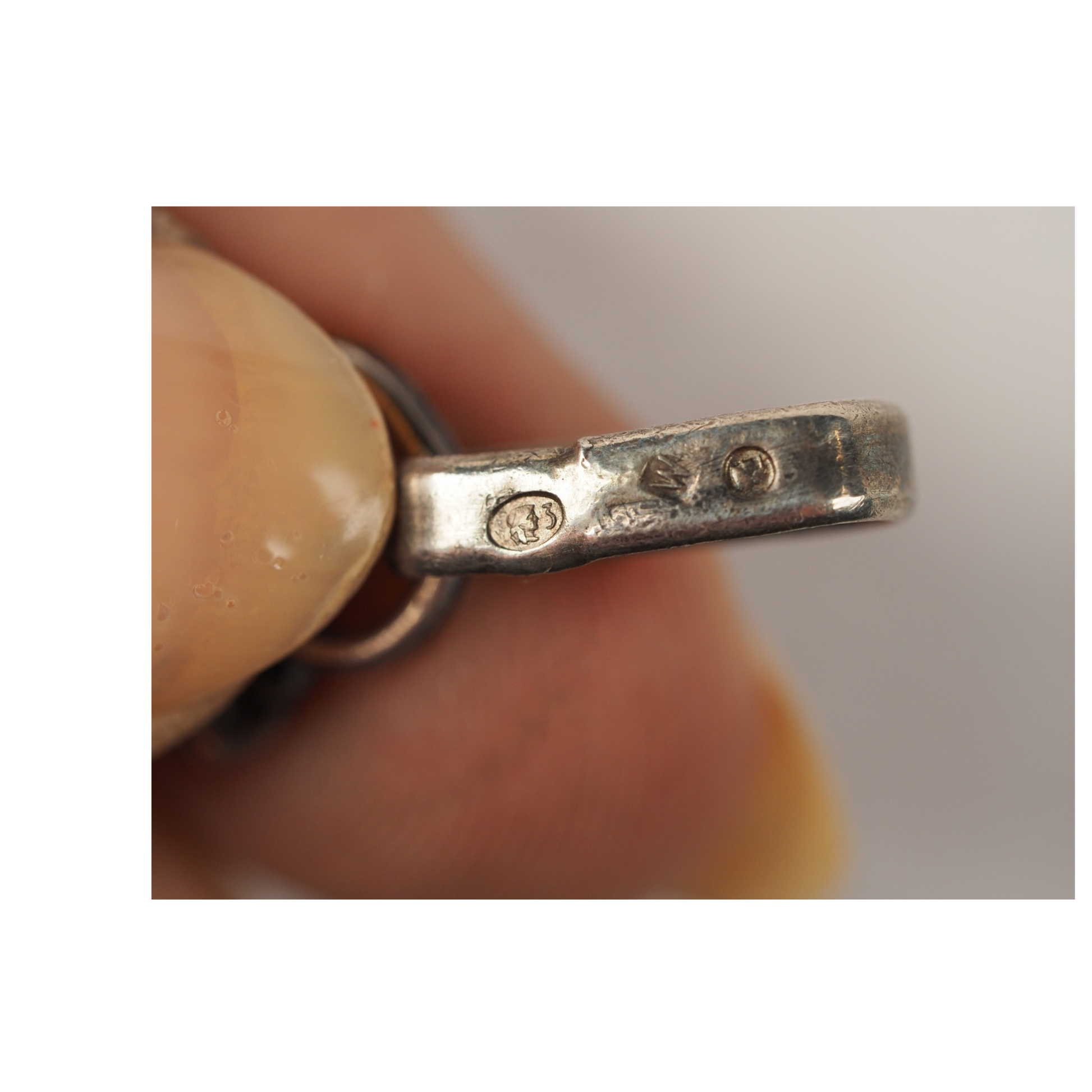 Detail of natural inclusions in vintage Baltic amber cabochon