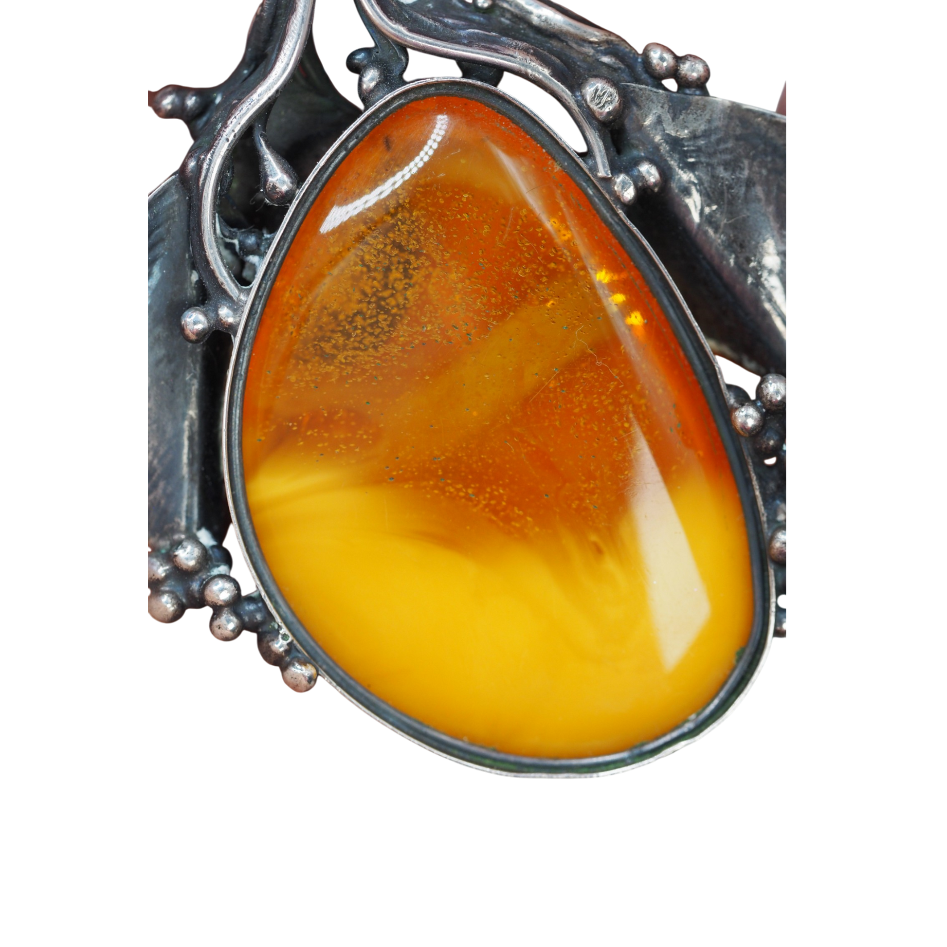 Oxidized silver botanical setting on Polish amber pendant