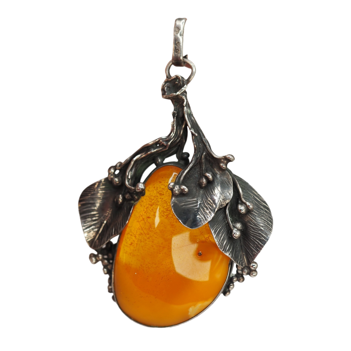 Large honey cognac Baltic amber cabochon in handwrought silver leaves