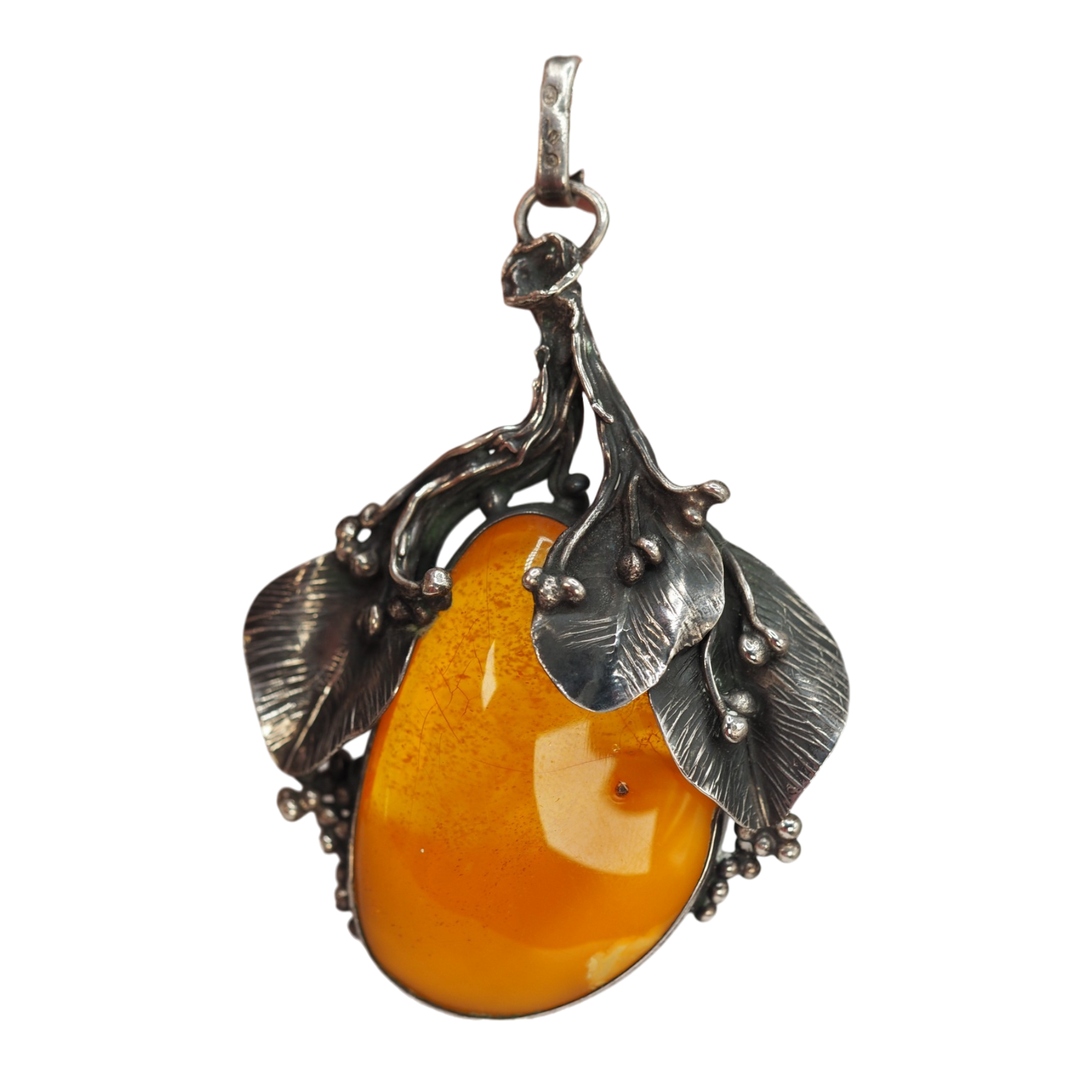 Large honey cognac Baltic amber cabochon in handwrought silver leaves