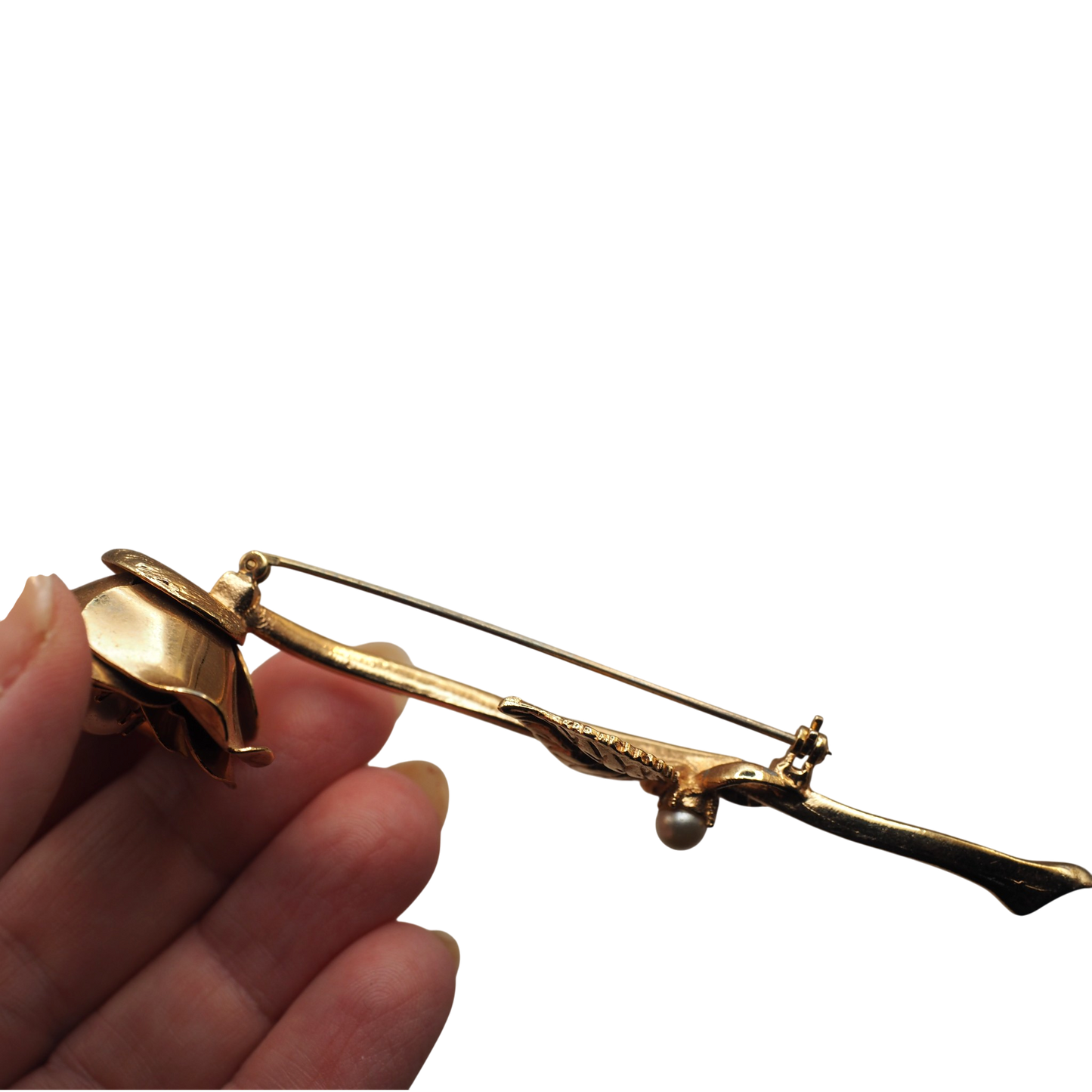 Gold tone rose brooch with a dual leaf stem and cream faux pearl