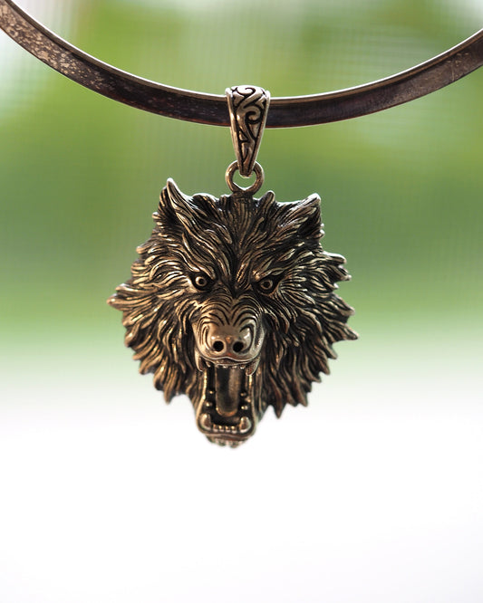 Sterling silver wolf head pendant on cord, open mouth showing teeth and dimensional fur, front view