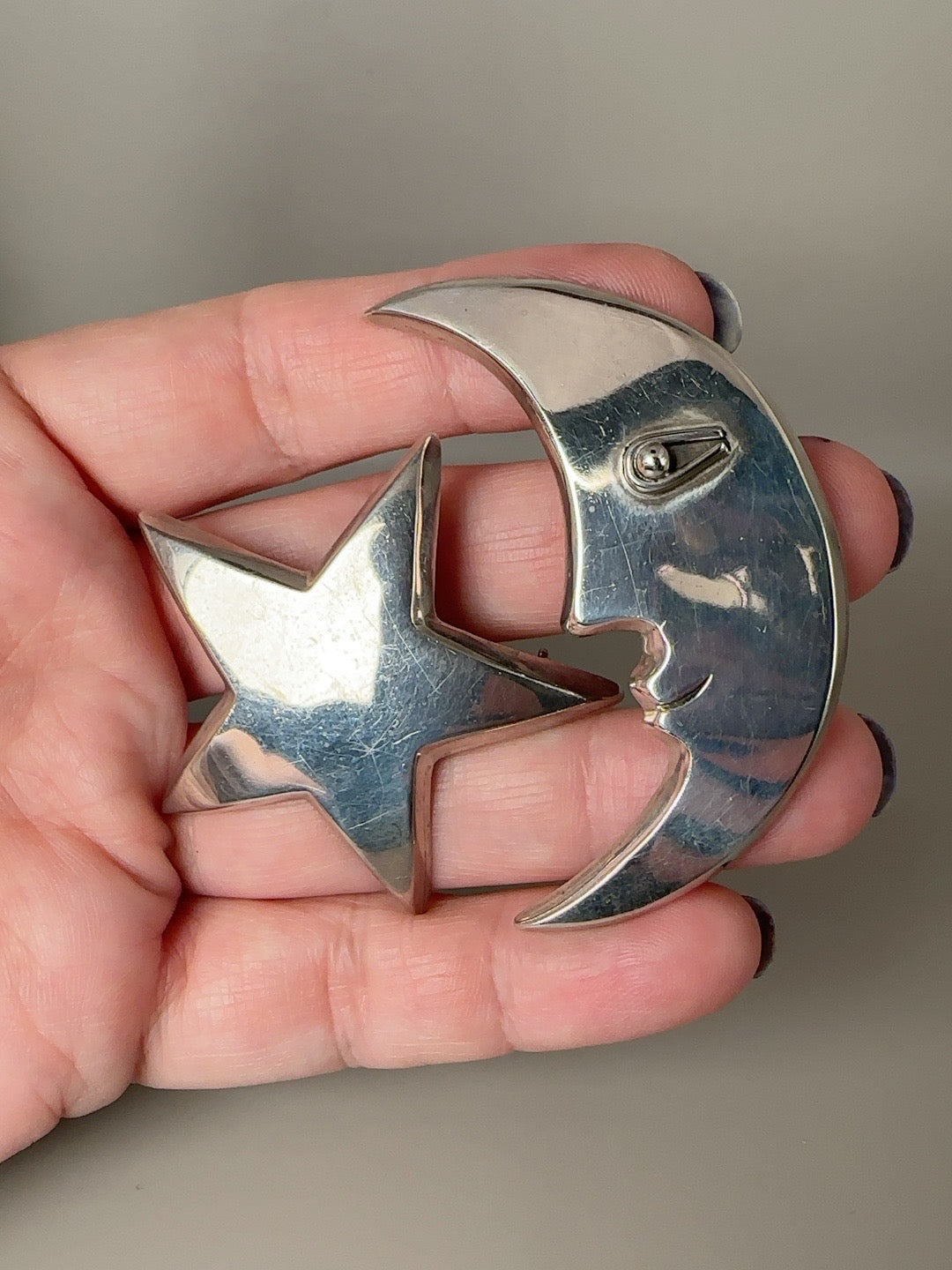 Vintage Taxco sterling modernist moon face and star celestial brooch pair