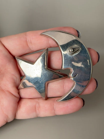 Vintage Taxco sterling modernist moon face and star celestial brooch pair