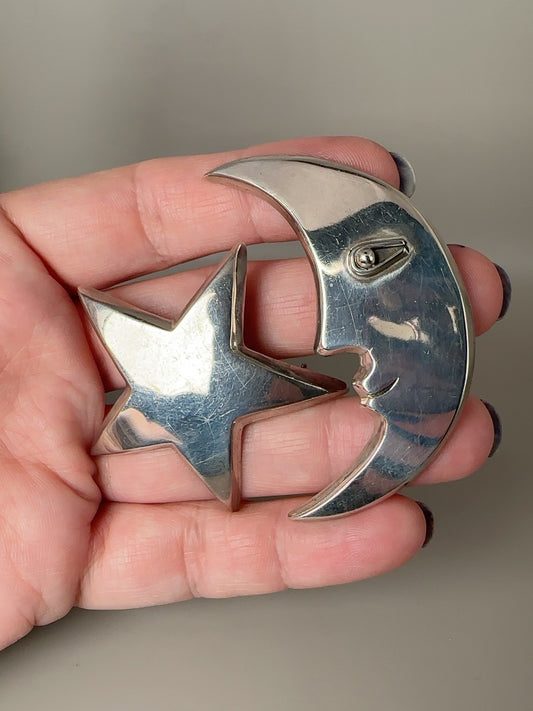 Vintage Taxco sterling modernist moon face and star celestial brooch pair