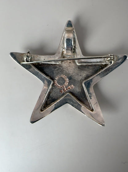 Reverse and hallmark detail of vintage Taxco sterling celestial brooch pieces