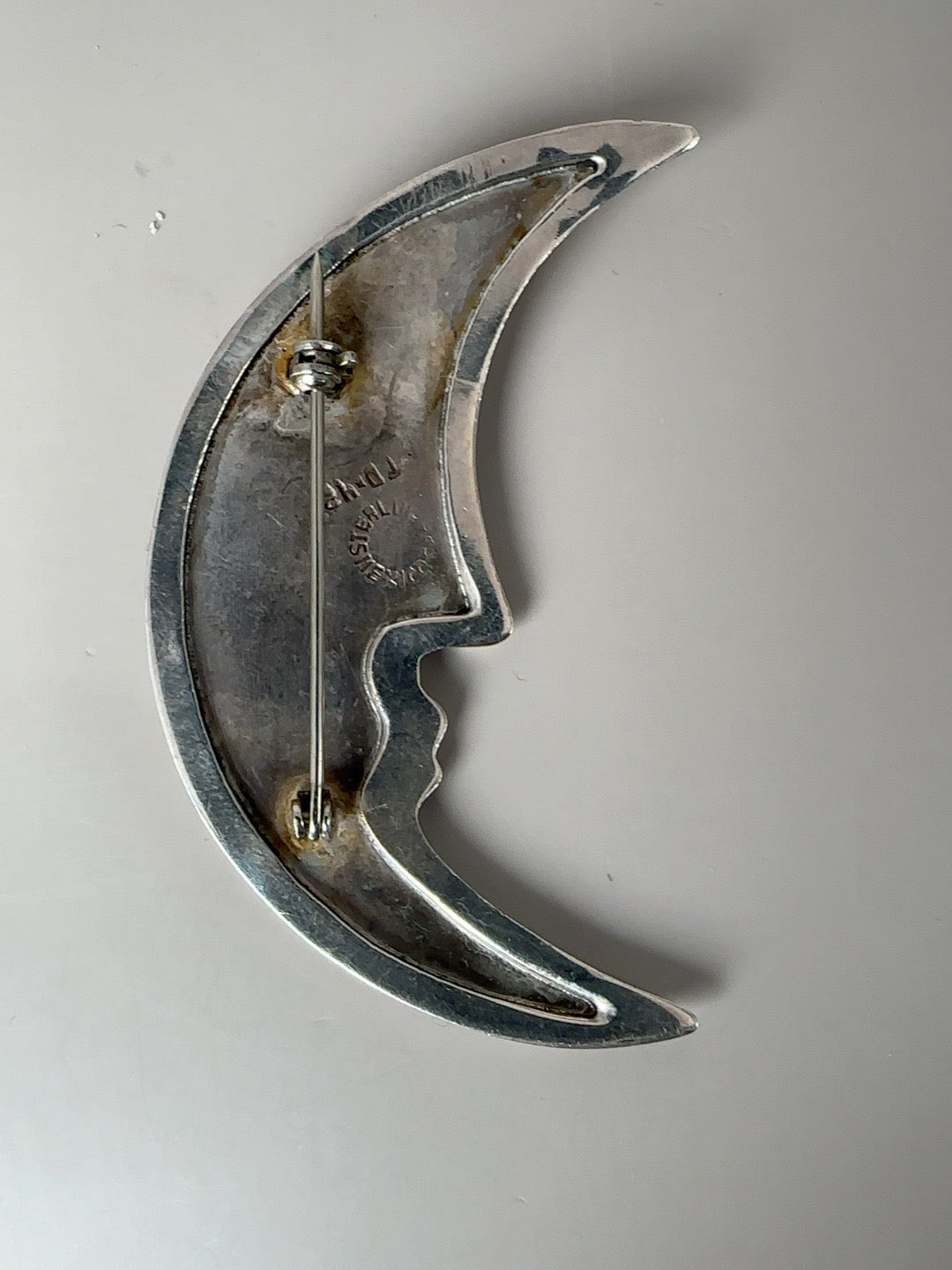 Vintage Taxco sterling moon face and star brooch pendant pair shown together