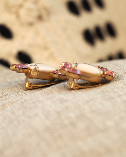 Back view of the clip earrings showing the gold-tone clip-on mechanisms on both earrings
