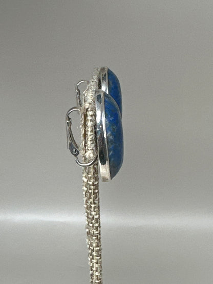 Close-up side angle showing bezel construction and lapis stone profile
