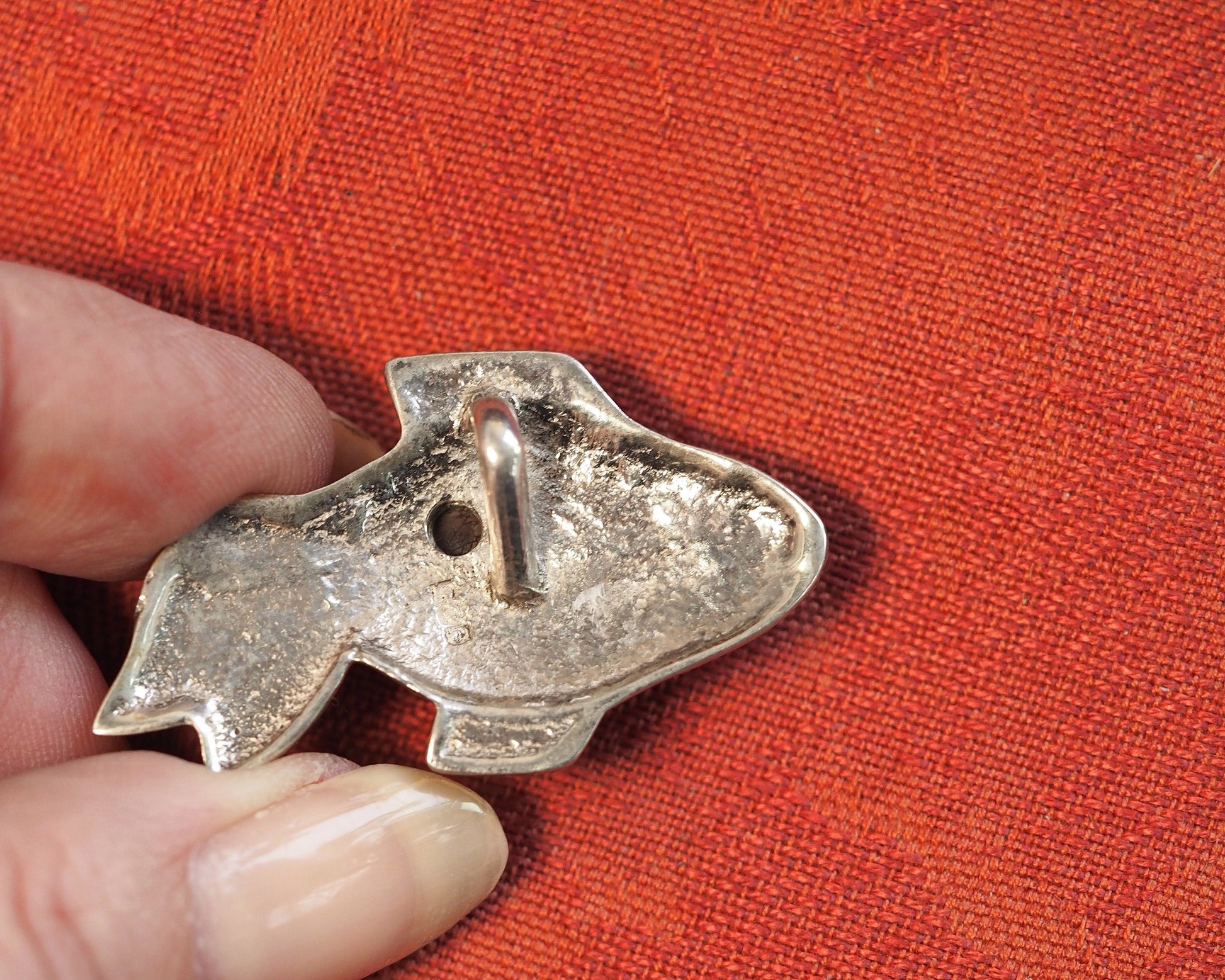 Reverse of fish pendant showing 925 hallmark and slide bail