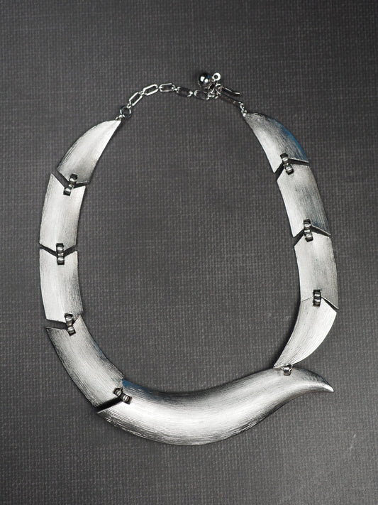 Signed Trifari modernist collar necklace with brushed silver-tone curved links, front view