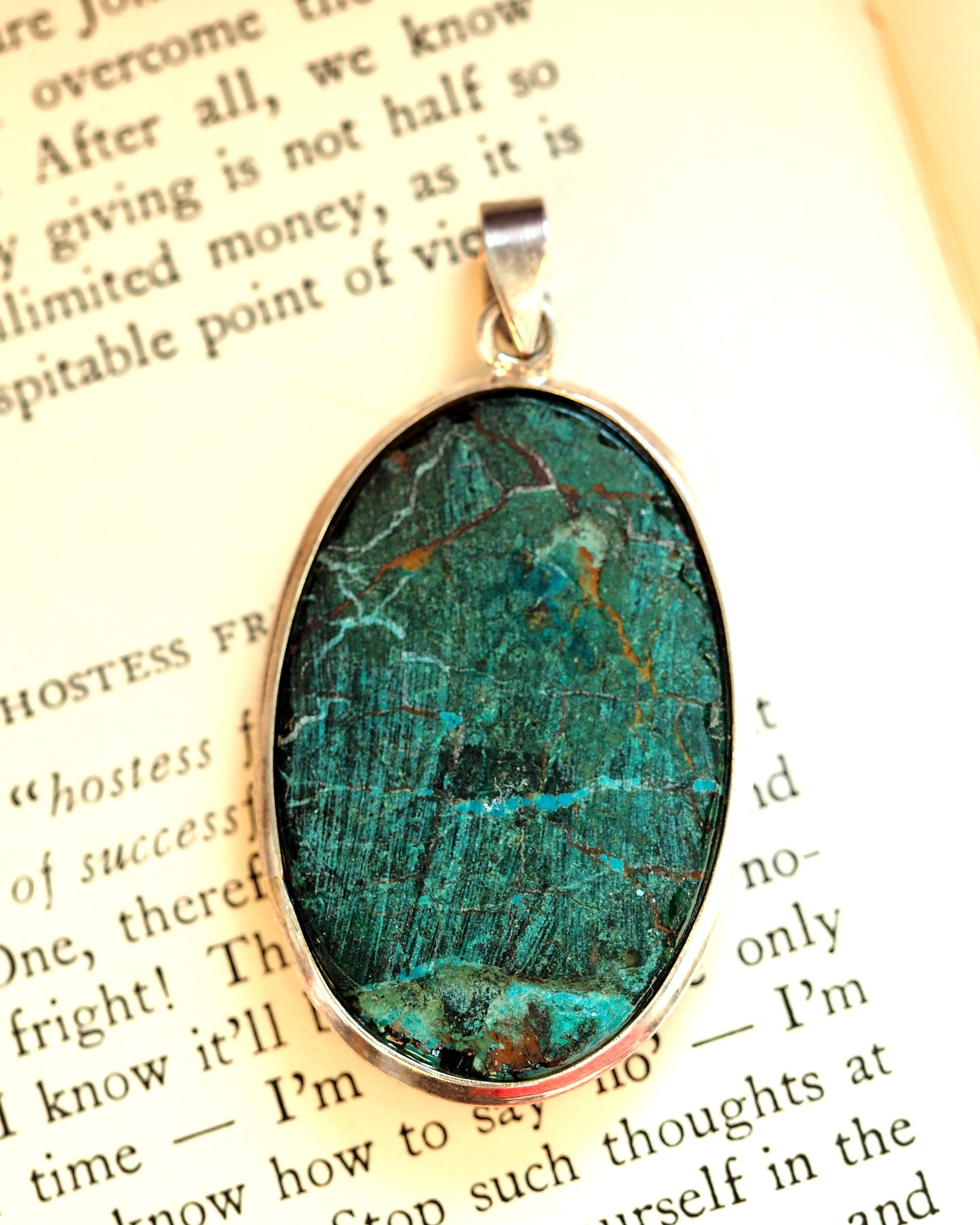 Reverse of turquoise pendant showing natural stone back with darker oxidized matrix