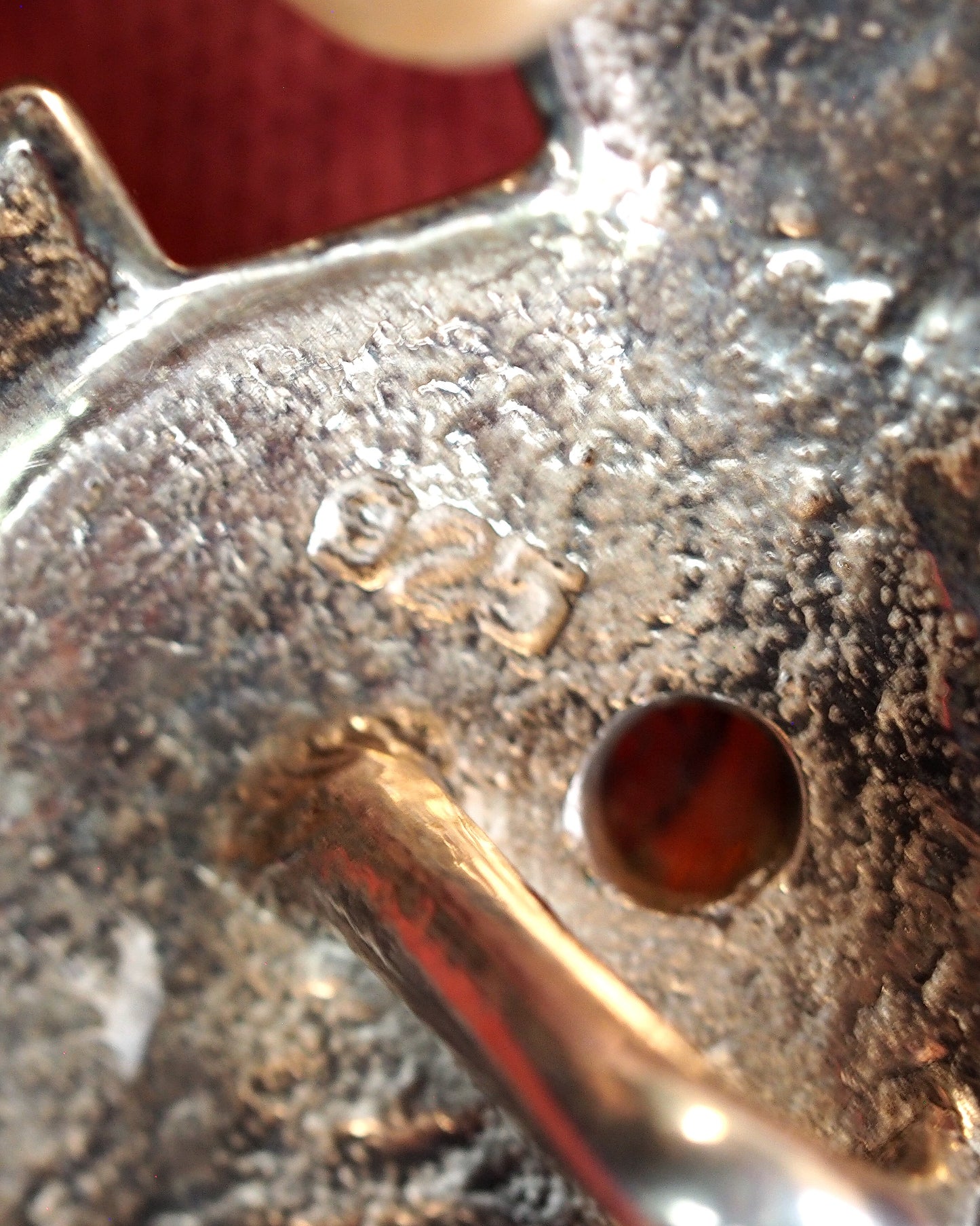 Close-up of 925 hallmark stamped on the reverse near the bail