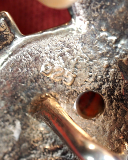 Close-up of 925 hallmark stamped on the reverse near the bail