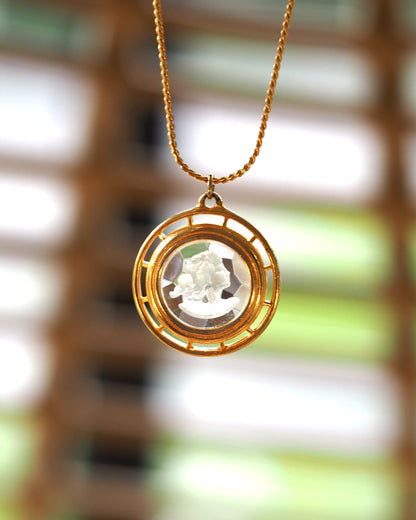 Mid-century gold-tone necklace with carved glass cameo in double-ring openwork frame, front view