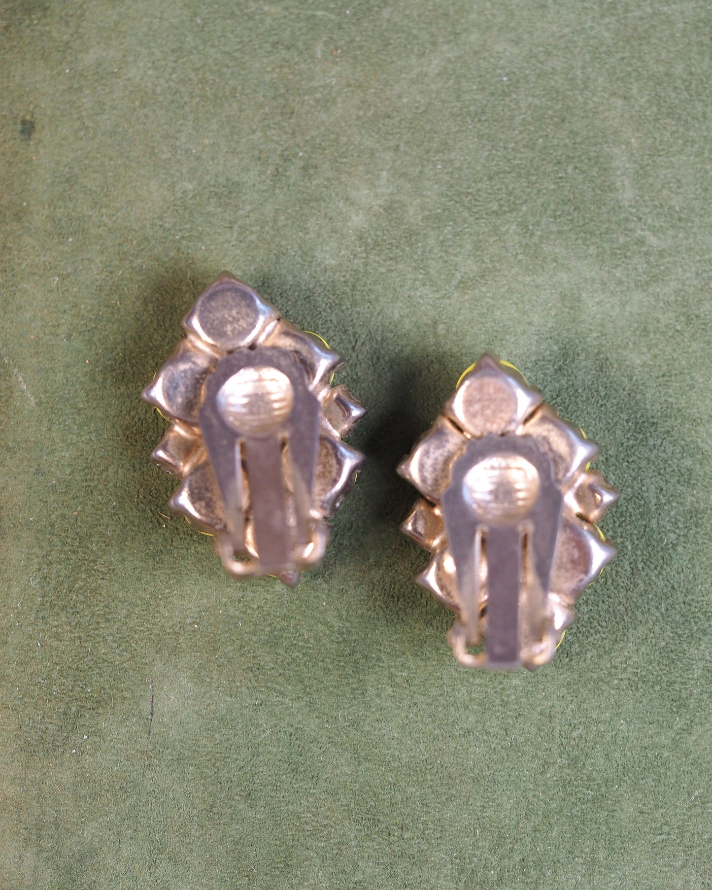 Reverse view of clip earrings showing gold-tone metal backing and clip mechanisms