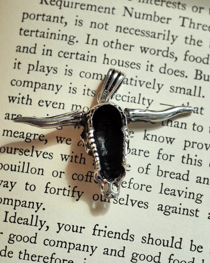 Back view of the sterling silver skull pendant showing hollow casting construction