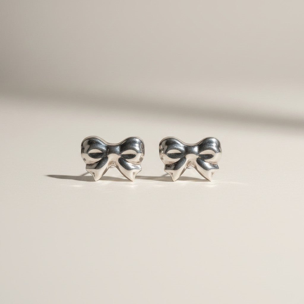 Charming Bow Sterling Silver Stud Earrings Earrings - GlamGram NYC
