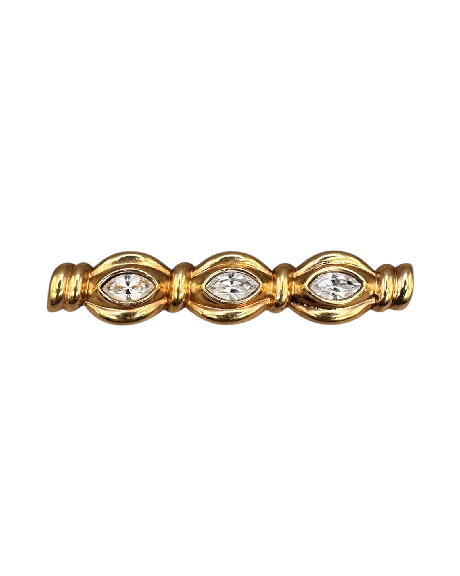 Front three-quarter view of gold-tone crystal bar pin showing bezel-set marquise stones