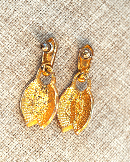 Gold-tone faux pearl earrings shown from the back with post and butterfly backs visible