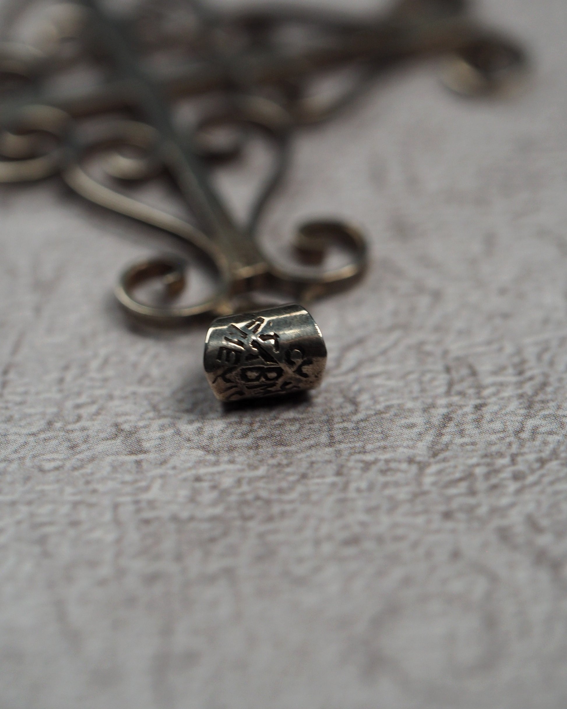 Close-up of the signed Taxco bail on the sterling silver cross pendant