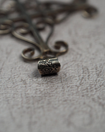 Close-up of the signed Taxco bail on the sterling silver cross pendant
