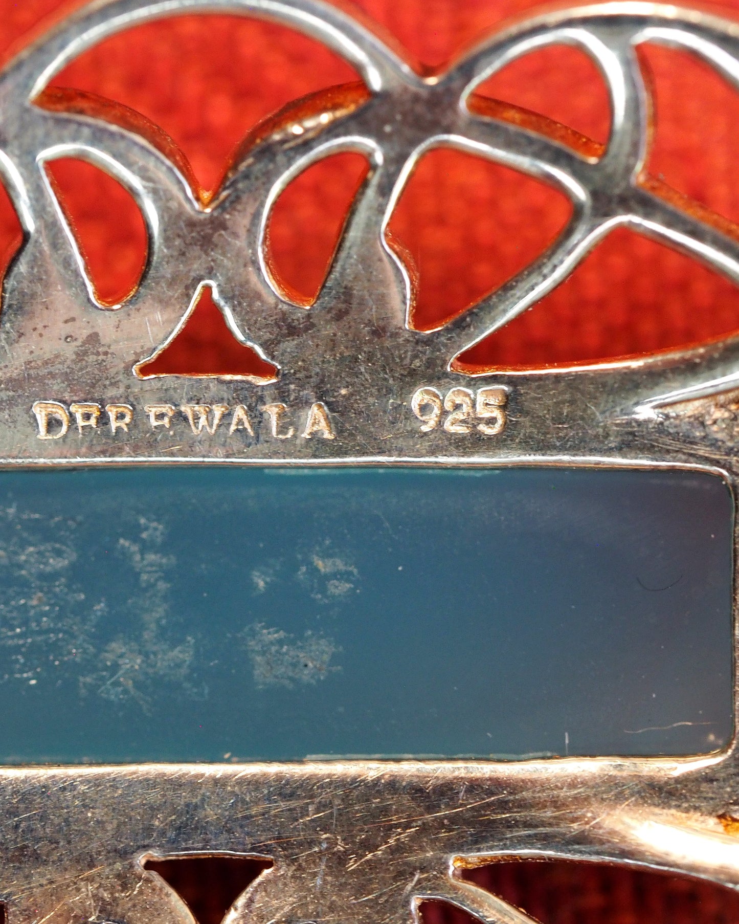 Close-up of DEREWALA 925 hallmark stamp on reverse of pendant