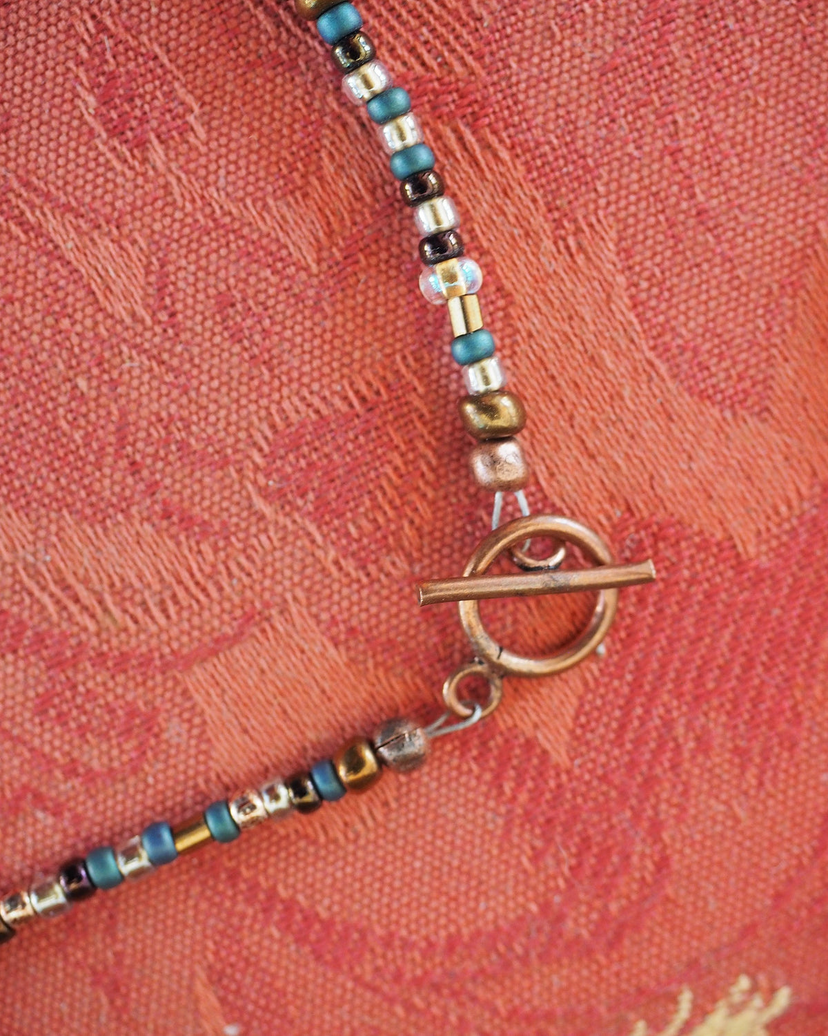 Handmade mixed glass bead necklace clasp detail
