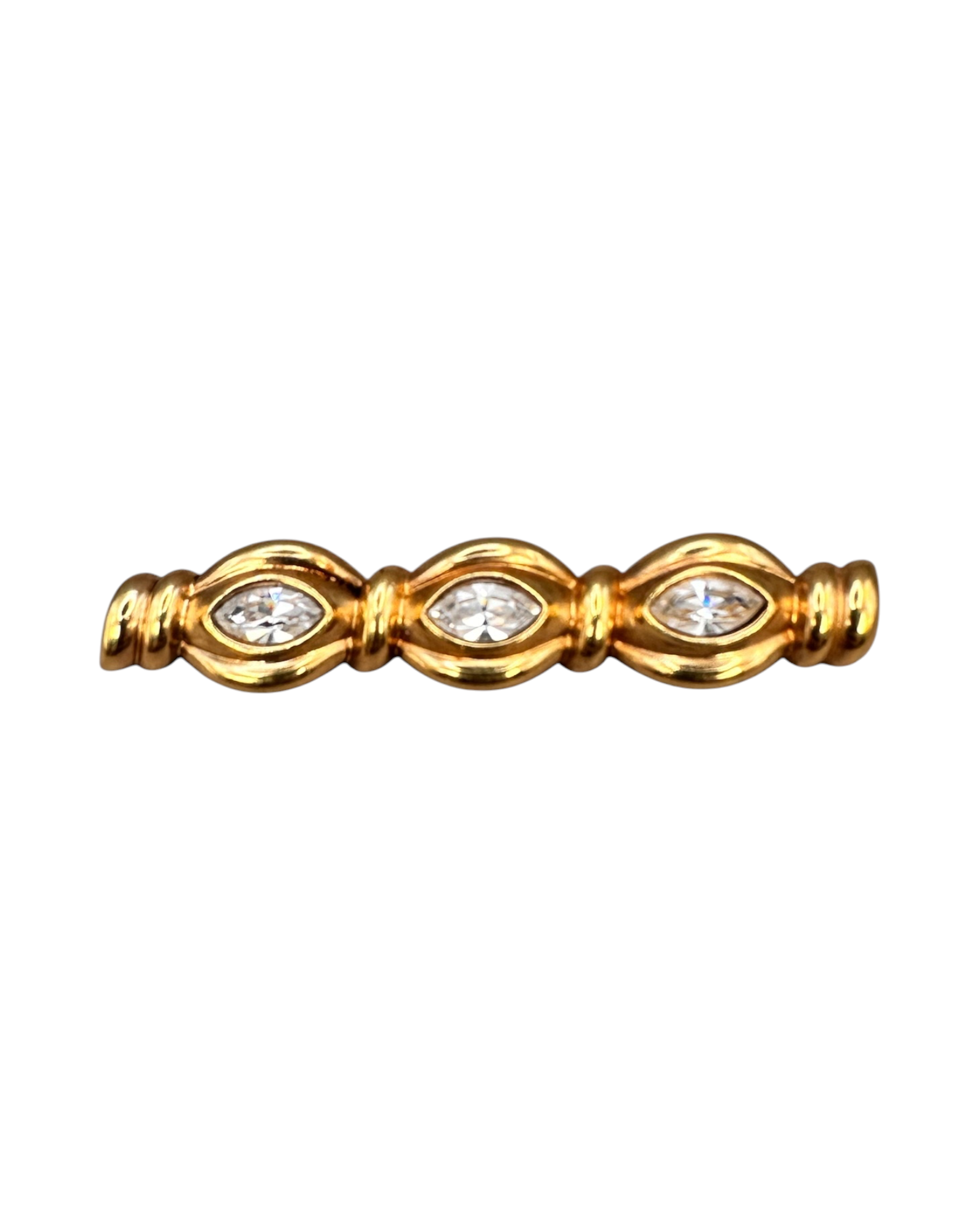Front view of gold-tone crystal bar pin showing three stones separated by ribbed barrel links