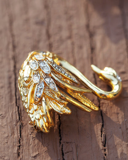 Side angle view of Marvella swan brooch showing three-dimensional relief and feather texture