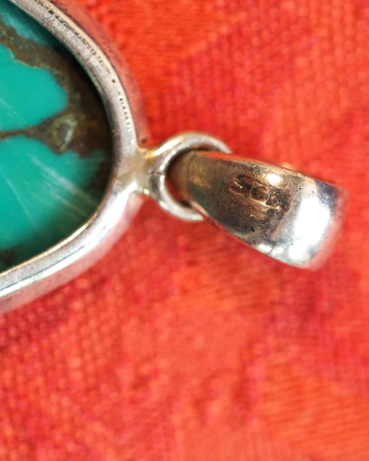 Close-up of 925 sterling stamp on the back of the slide bail